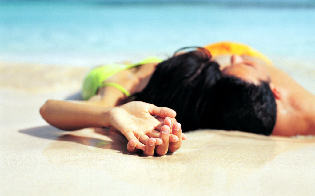 Couple Lying on a Beach
